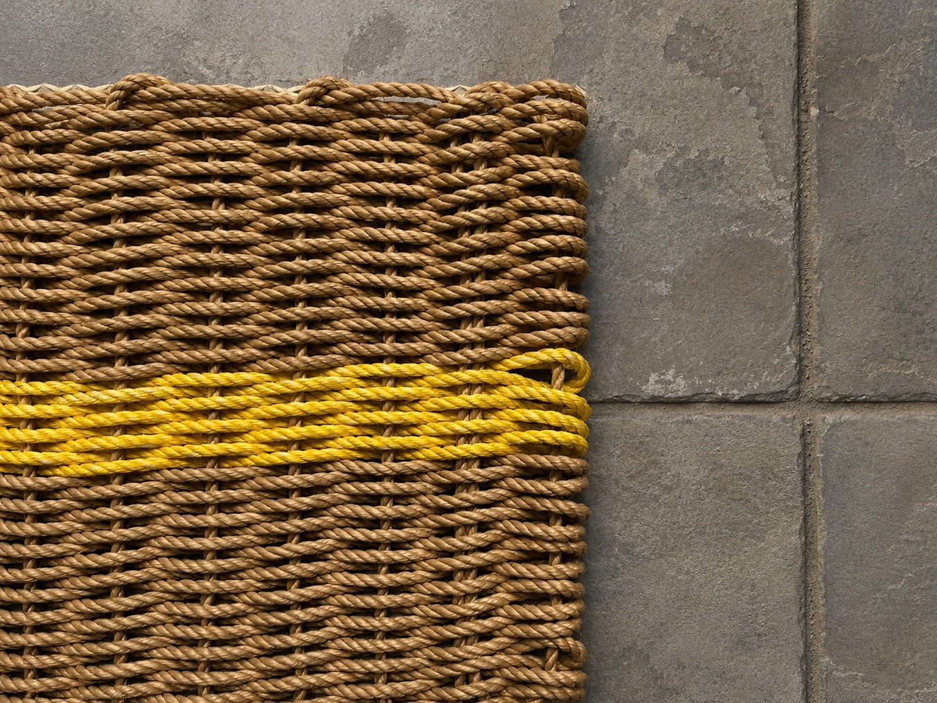 Handwoven reclaimed fishing rope door mat with harbour yellow stripe