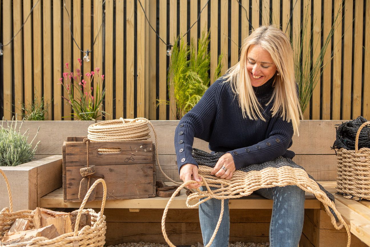 Zoe handweaving a rope doormat in a Newquay, Lovan Cornwall.
